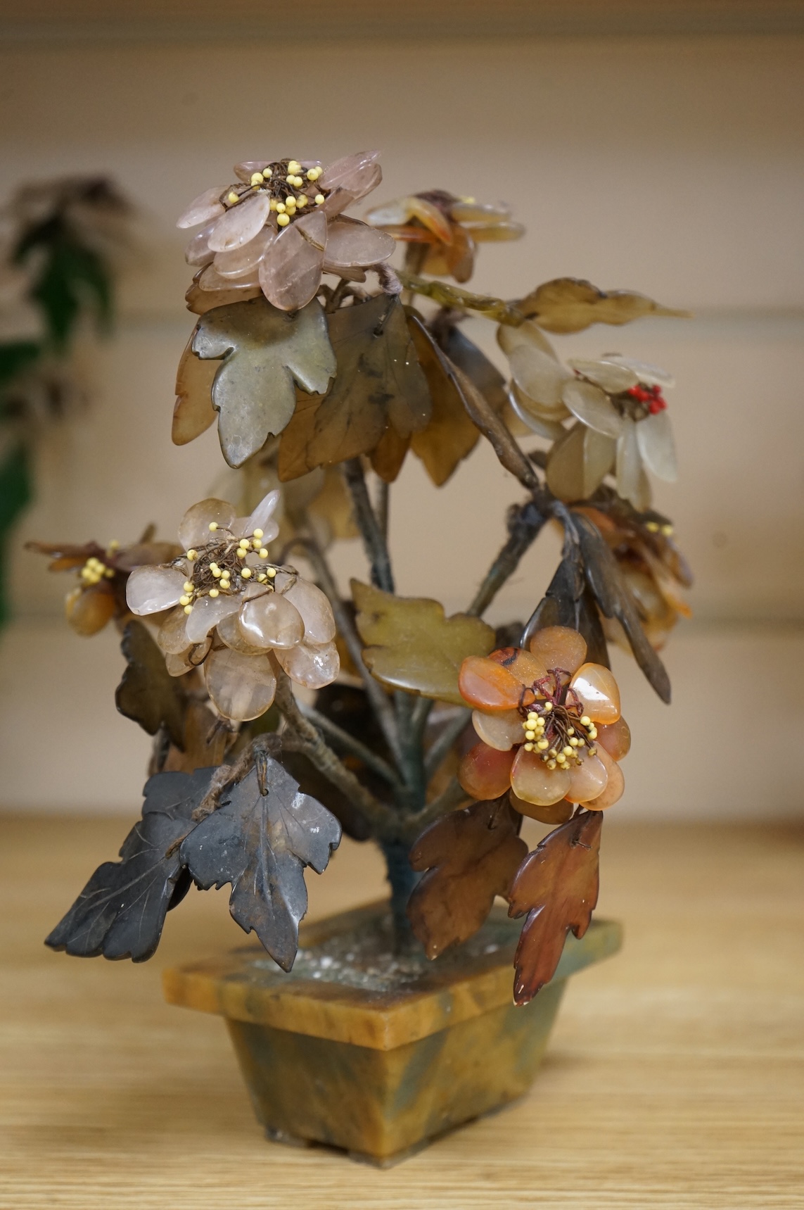 A collection of four ornamental Chinese hardstone flowering trees, tallest 22cm.